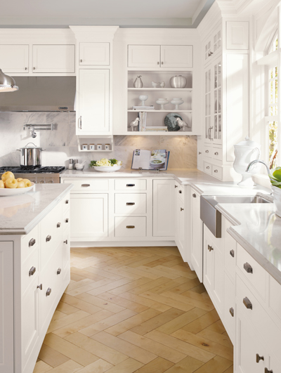 White kitchen cabinets with backsplash. 